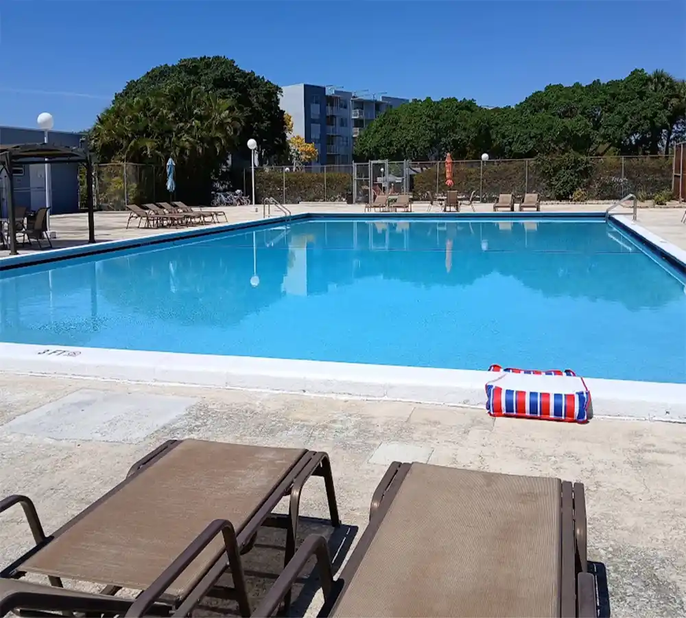 New Listing Coming Soon Breakwaters Condo <br>470 Executive Center Dr 4N, West Palm Beach, FL 33401 470 Executive Center Dr 4N West Palm Beach FL 33401-2979 Swimming Pool with Lounge Chairs & Trees